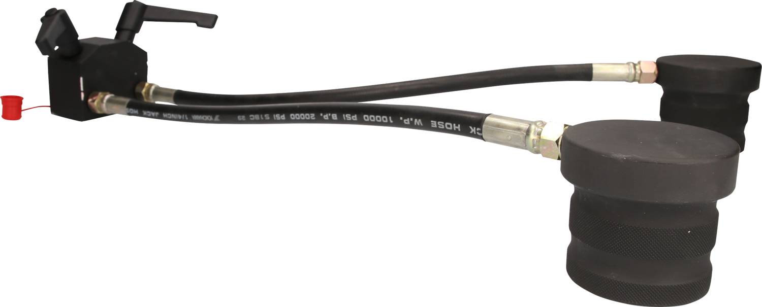 Hydraulische Schnellkupplung mit zwei schwarzen Schläuchen und Kunststoffkappen an den Enden, geeignet für industrielle Anwendungen.