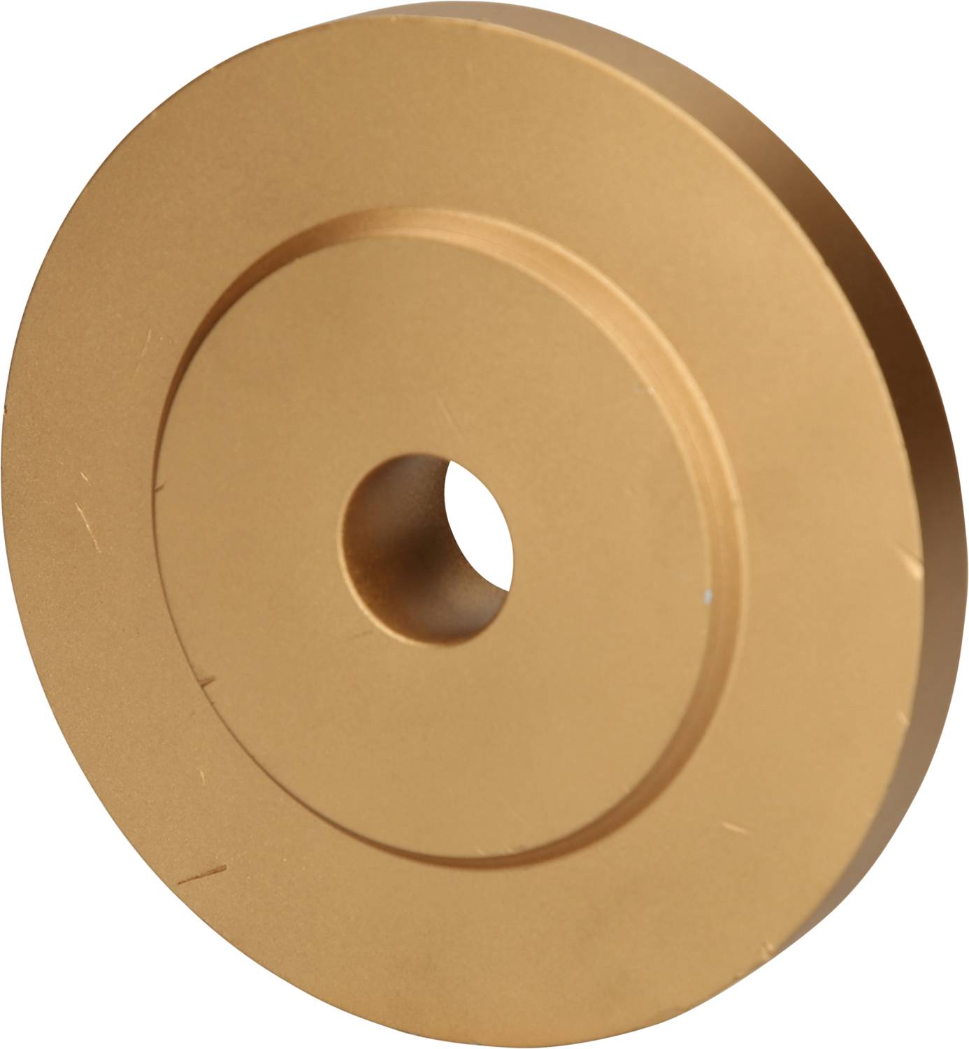 Goldene, scheibenförmige Metallkomponente mit einem zentralen Loch und konzentrischen Kreisen.