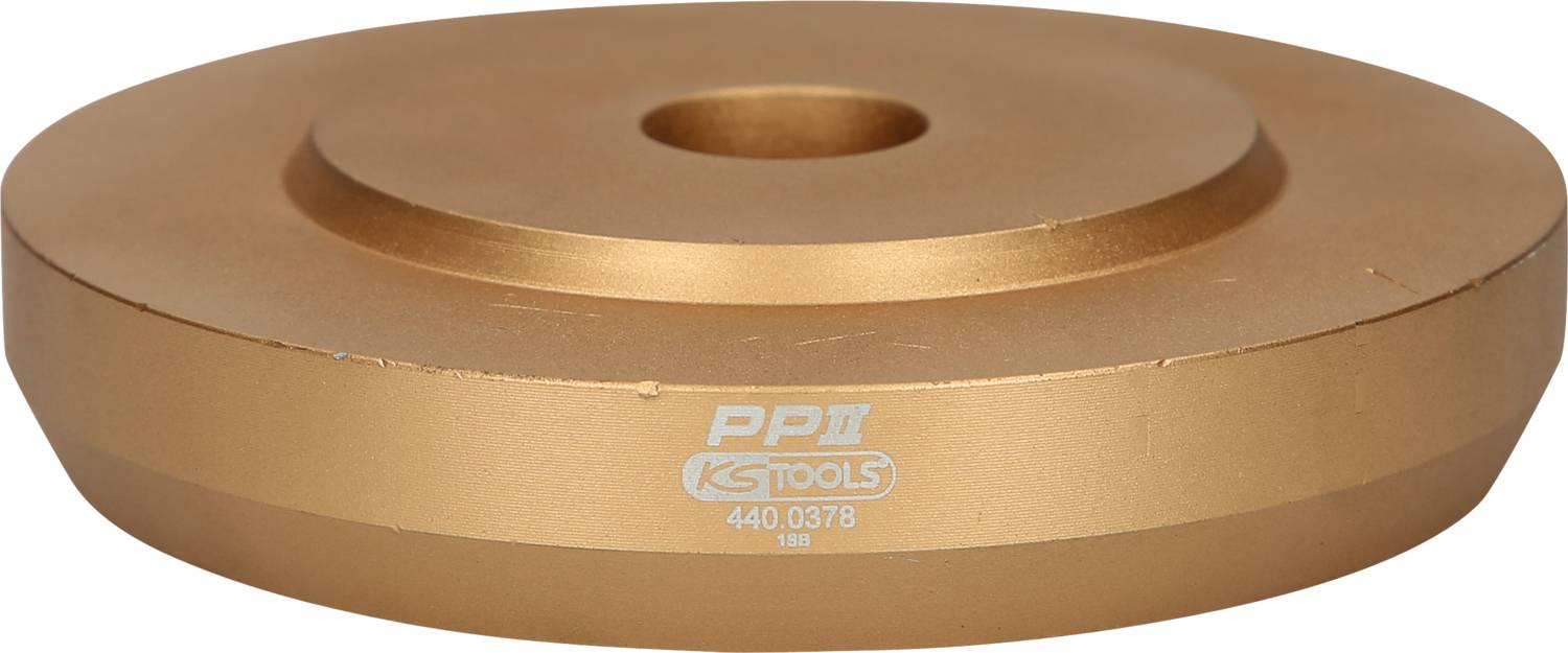 Ein runder, goldfarbener Metallaufsatz mit der Gravur 'PP II KS TOOLS 440.0378 180' auf der Vorderseite.
