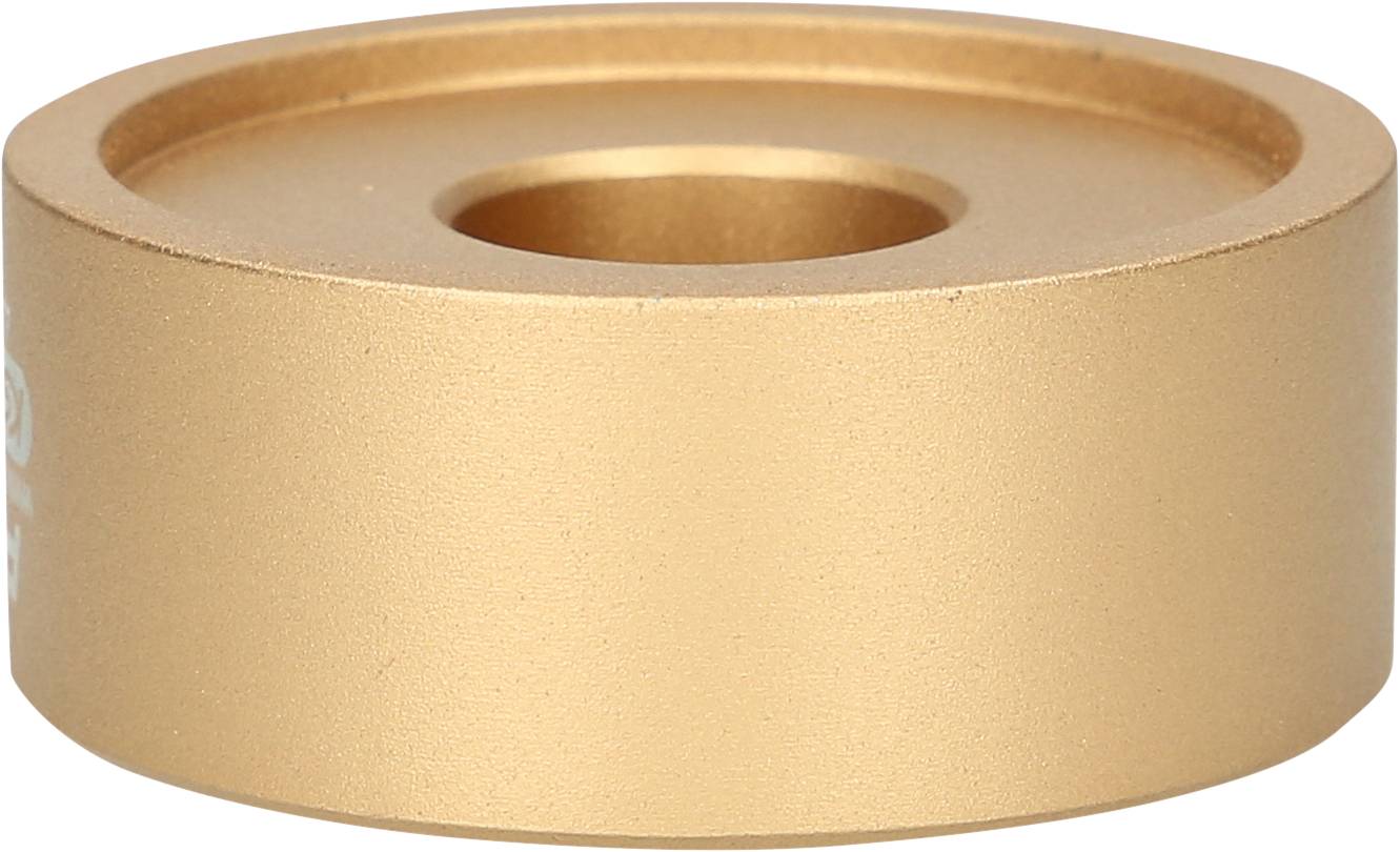 Ein bronzefarbener, runder Metallzylinder mit einem zentralen Loch, verwendet als Gewicht oder Abstandshalter in mechanischen Anwendungen.