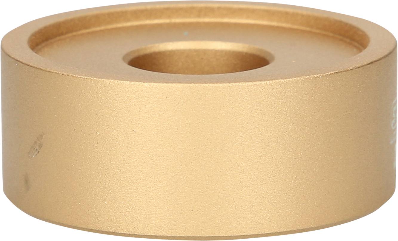 Goldener runder Metallblock mit Loch in der Mitte, flach und gleichmäßig. 