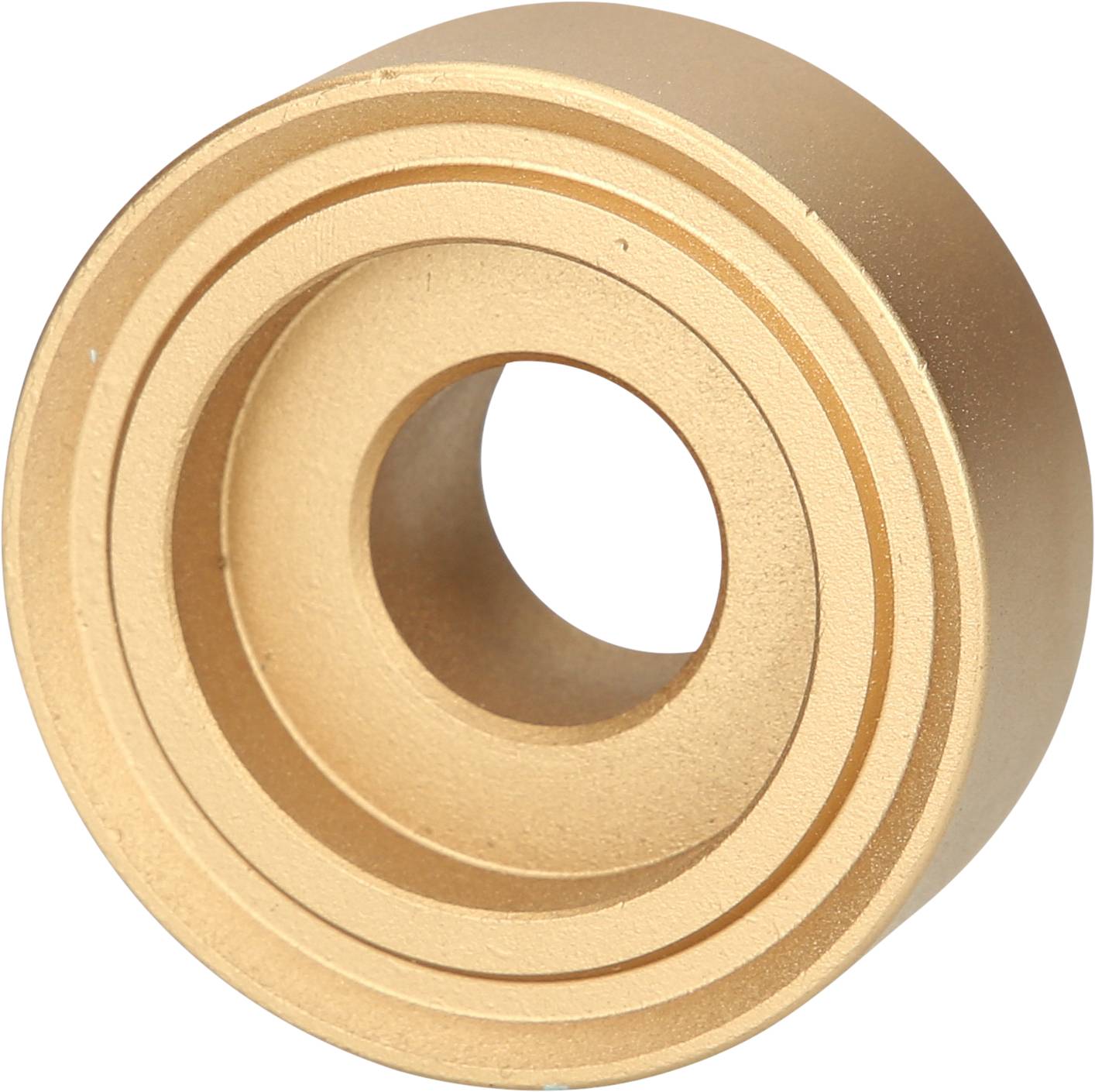 Ein rundes, goldfarbenes Metalllager mit mehreren konzentrischen Kreisen und einer zentralen Öffnung.