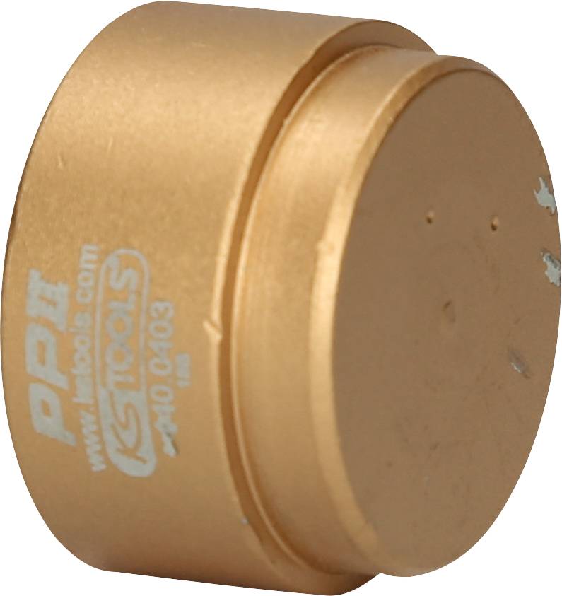 Goldfarbener Metallzylinder mit der Aufschrift 'PPI KS Tools'.