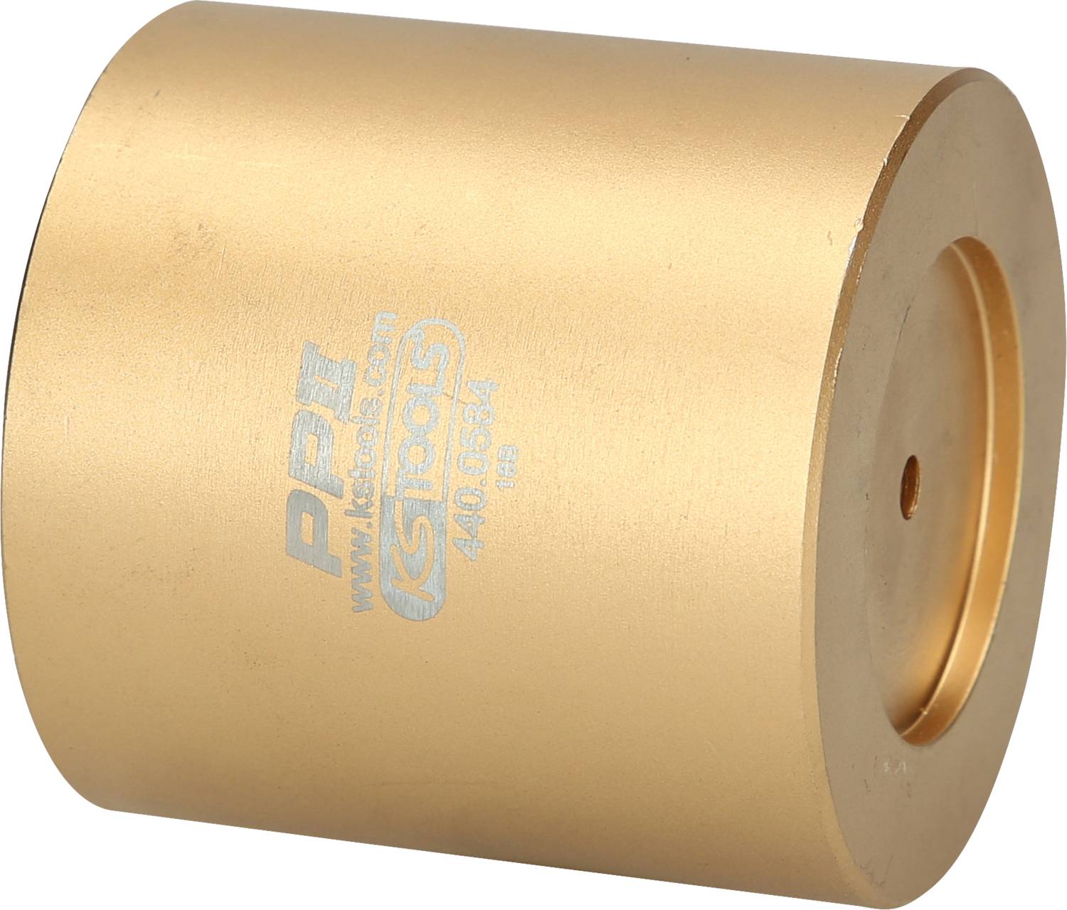 Ein goldener zylindrischer Metallblock mit Gravur an der Seite.