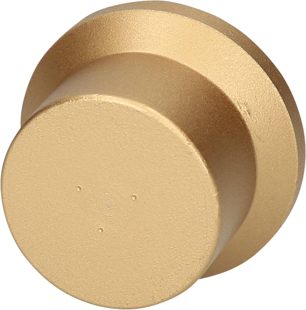 Ein goldfarbener, runder Wandhaken aus Metall mit einer glatten, matten Oberfläche.