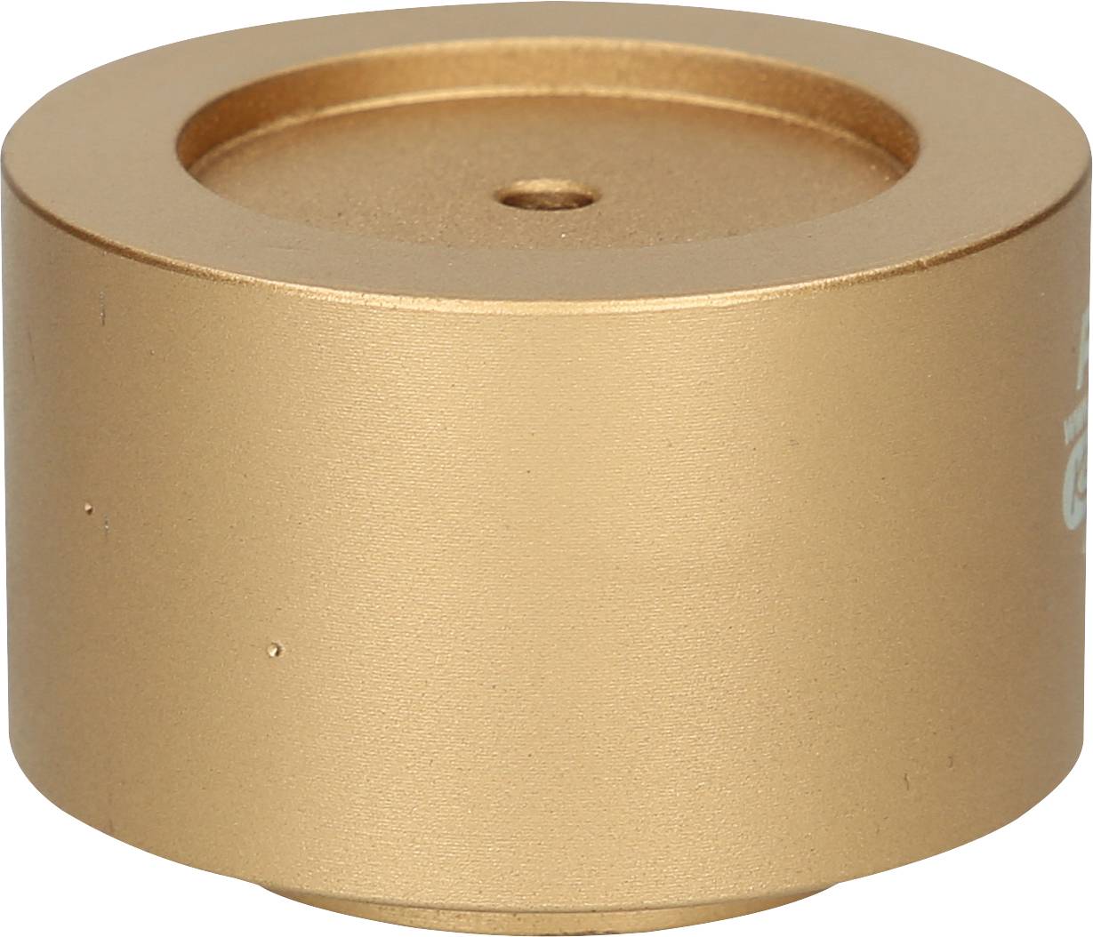 Ein zylinderförmiger, goldfarbener Metallbehälter mit glatter Oberfläche und einer kleinen zentralen Vertiefung.