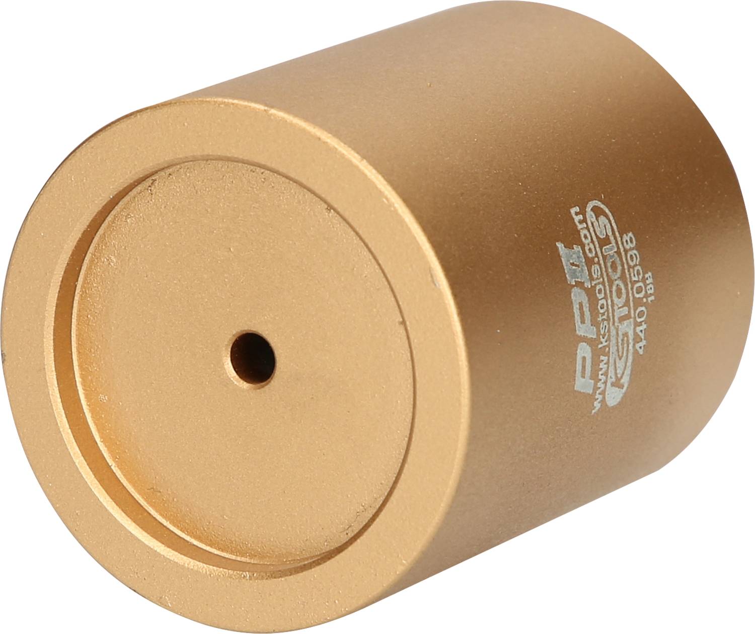 Ein zylinderförmiger, goldfarbener Metallblock mit einer zentralen Bohrung auf einer Seite; verwendet in technischen Anwendungen.