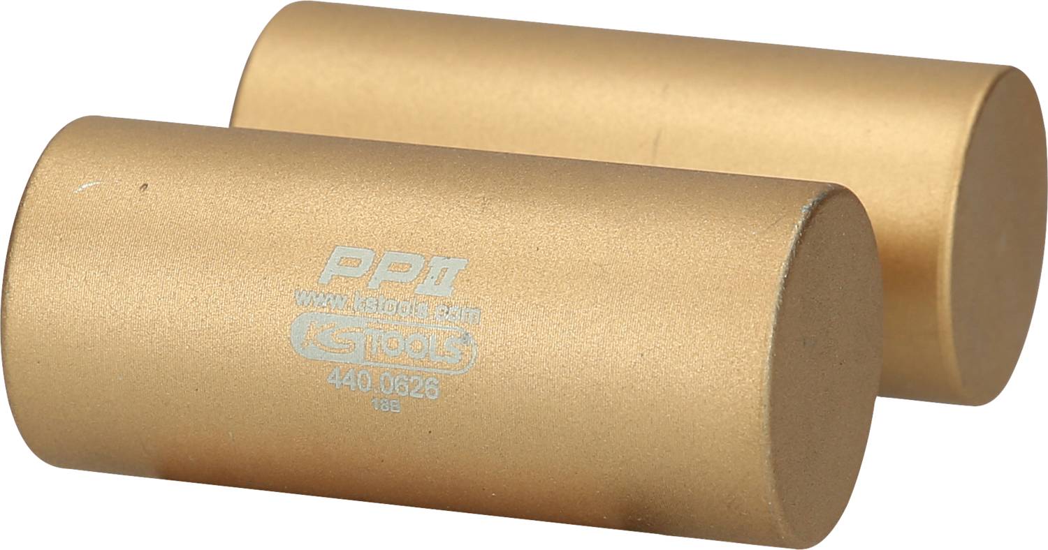 Zwei goldfarbene, zylinderförmige Werkzeuge aus Metall mit aufgedrucktem Text. Sie dienen vermutlich als Gewichte oder Abstandshalter.