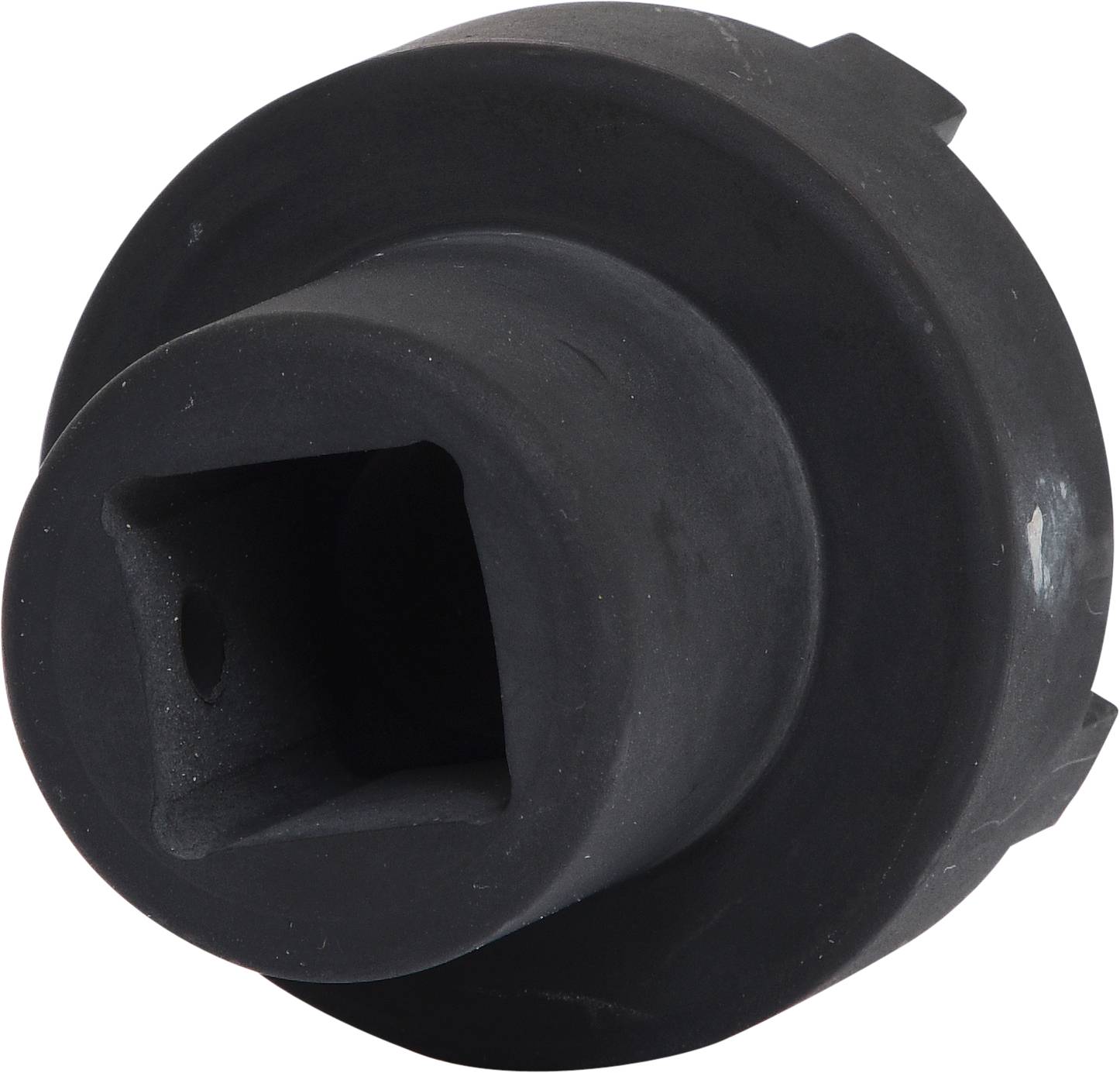 Ein schwarzes, zylindrisches Metallwerkzeug mit sechseckiger Öffnung für Schraubenanwendung.