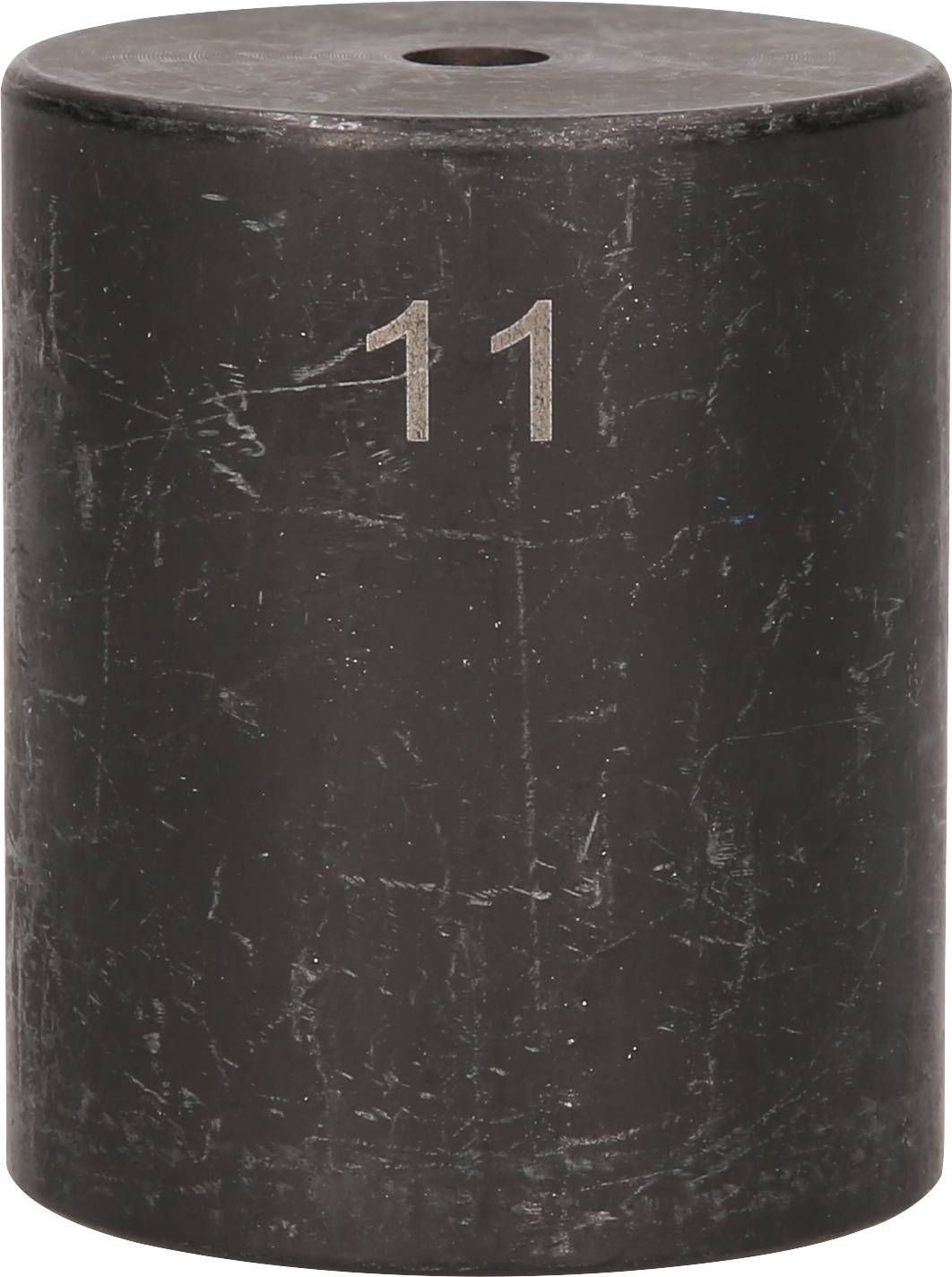 Schwarzer zylindrischer Gewichtstein mit der Zahl '11' darauf.