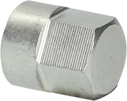 Eine sechseckige Metallmutter mit glatter Oberfläche liegt schräg auf einer weißen Fläche.