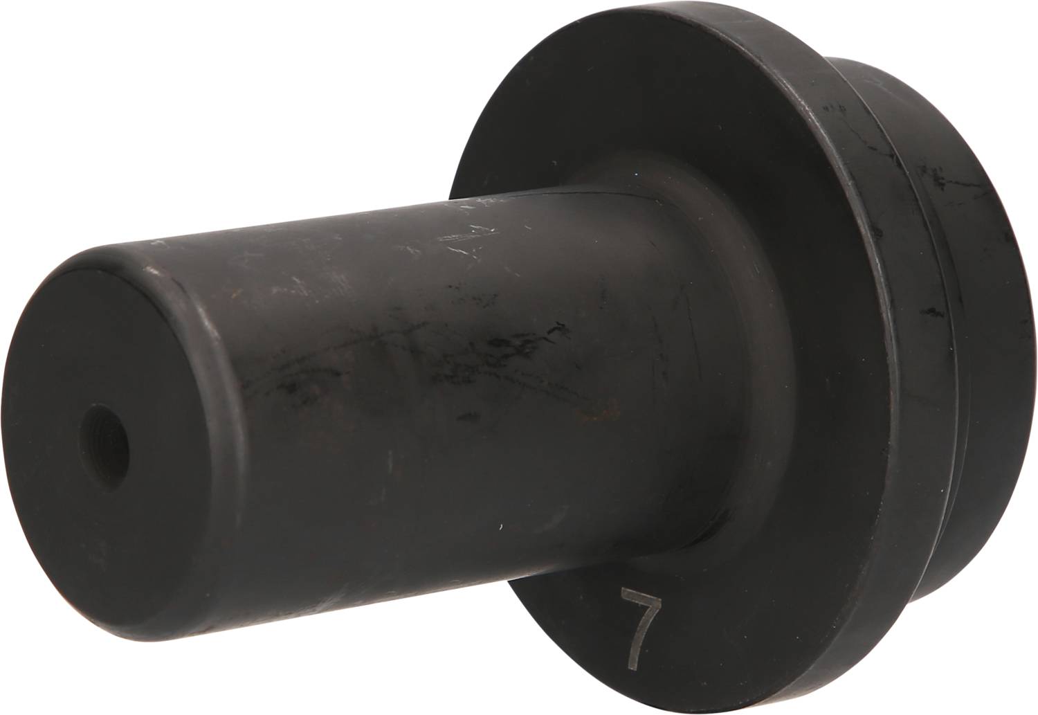 Schwarzes Metallteil in Zylinderform mit breiterer Basis, möglicherweise ein mechanisches oder technisches Bauteil.