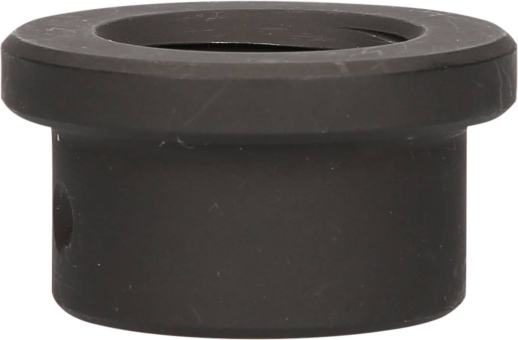 Ein zylindrisches, schwarzes Plastikobjekt mit breitem Rand und offener Mitte. Es sieht aus wie ein Adapter oder eine Buchse.