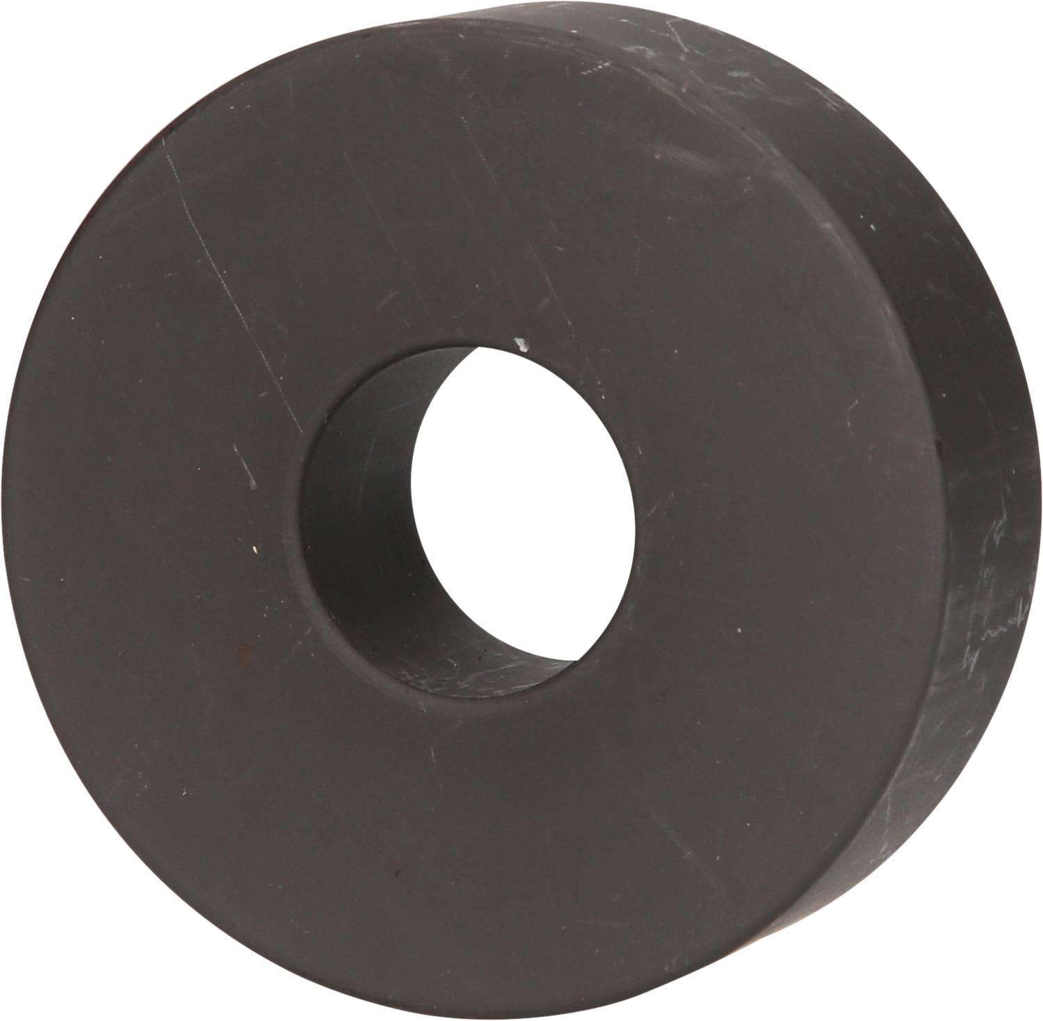 Schwarzer, ringförmiger Magnet mit mittigem Loch, ähnlich einer Unterlegscheibe.