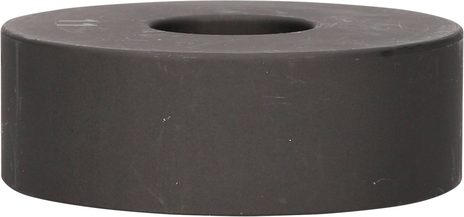 Ein runder, schwarzer Ferrit-Magnet in Form einer Scheibe mit einem Loch in der Mitte. Häufig verwendet in elektronischen Geräten.