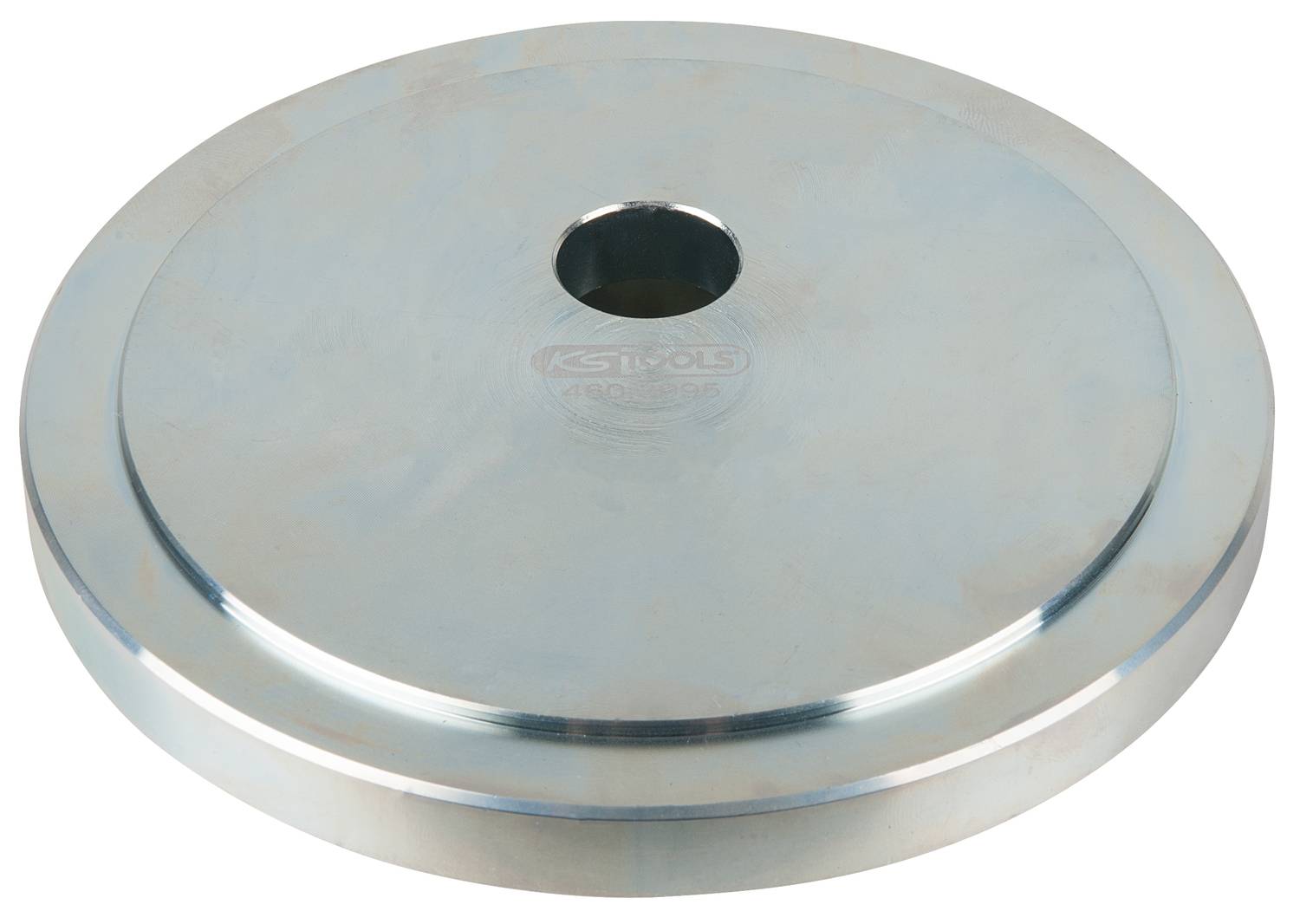 Eine flache, runde Metallscheibe mit einem Loch in der Mitte, verwendet als Adapter oder Gewicht in technischen Anwendungen.