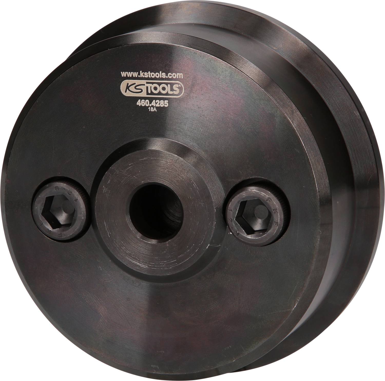 Rundes, metallisches Bauteil mit zentraler Bohrung und zwei seitlichen Sechskantschrauben; Herstellername 'KS Tools' sichtbar.