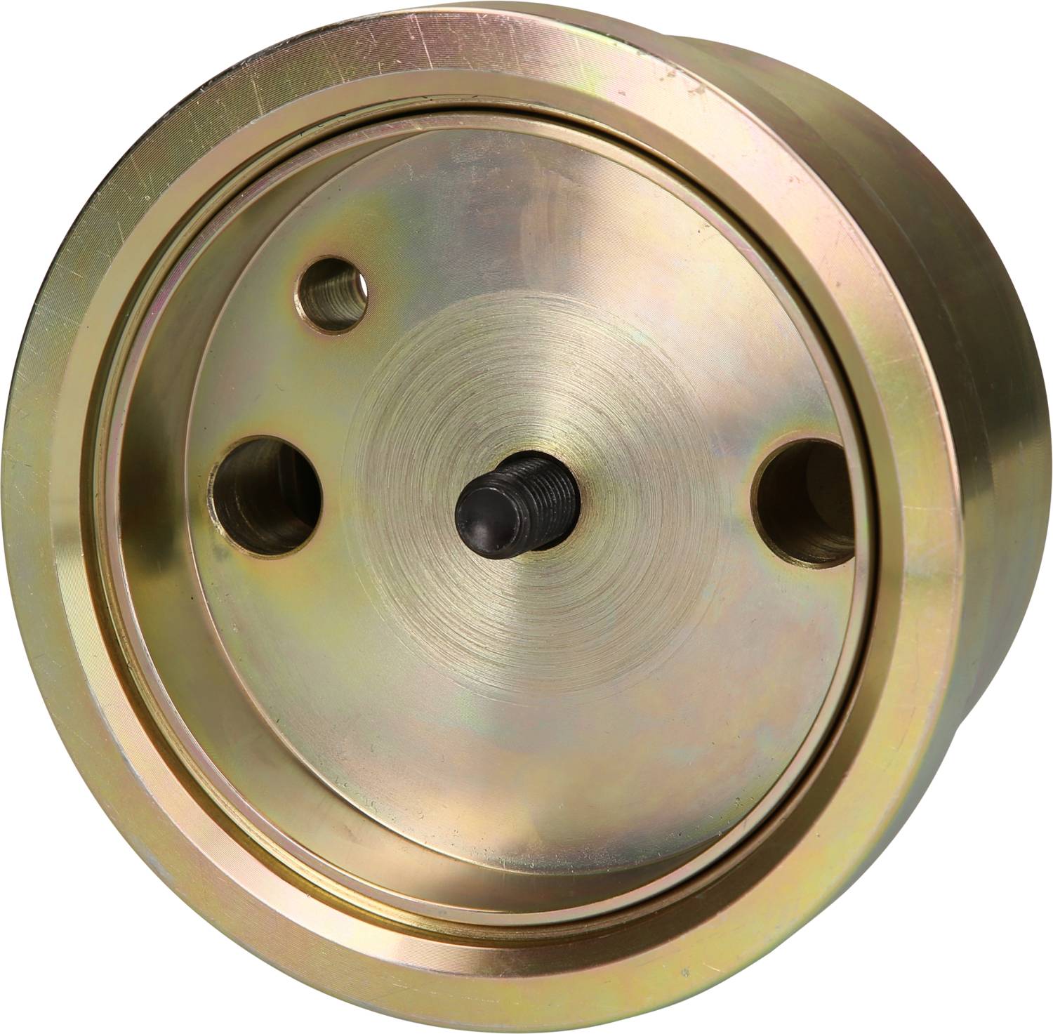 Ein rundes, messingfarbenes Metallteil mit mehreren Öffnungen und einer zentralen Schraube. Es scheint Teil einer mechanischen Vorrichtung zu sein.