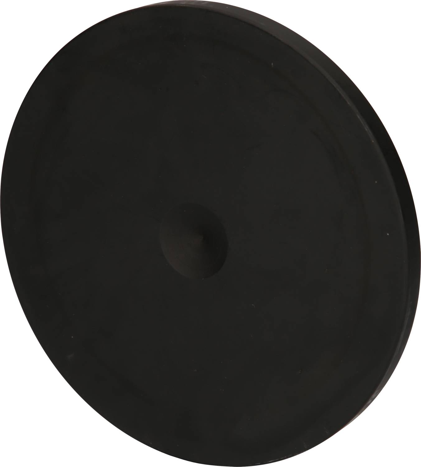 Eine schwarze Gummischeibe, ähnlich einer Dichtung oder Abdeckung, vor einem neutralen Hintergrund.