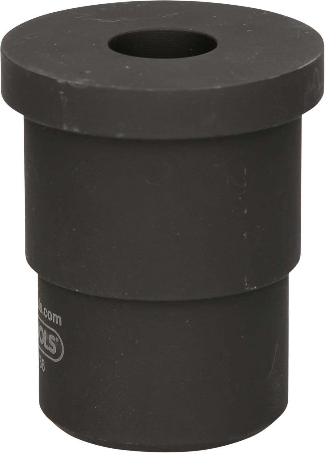 Ein schwarzer Zylinderadapter mit einem Loch oben. Er scheint aus einem robusten Material gefertigt zu sein, wie Gummi oder Kunststoff.