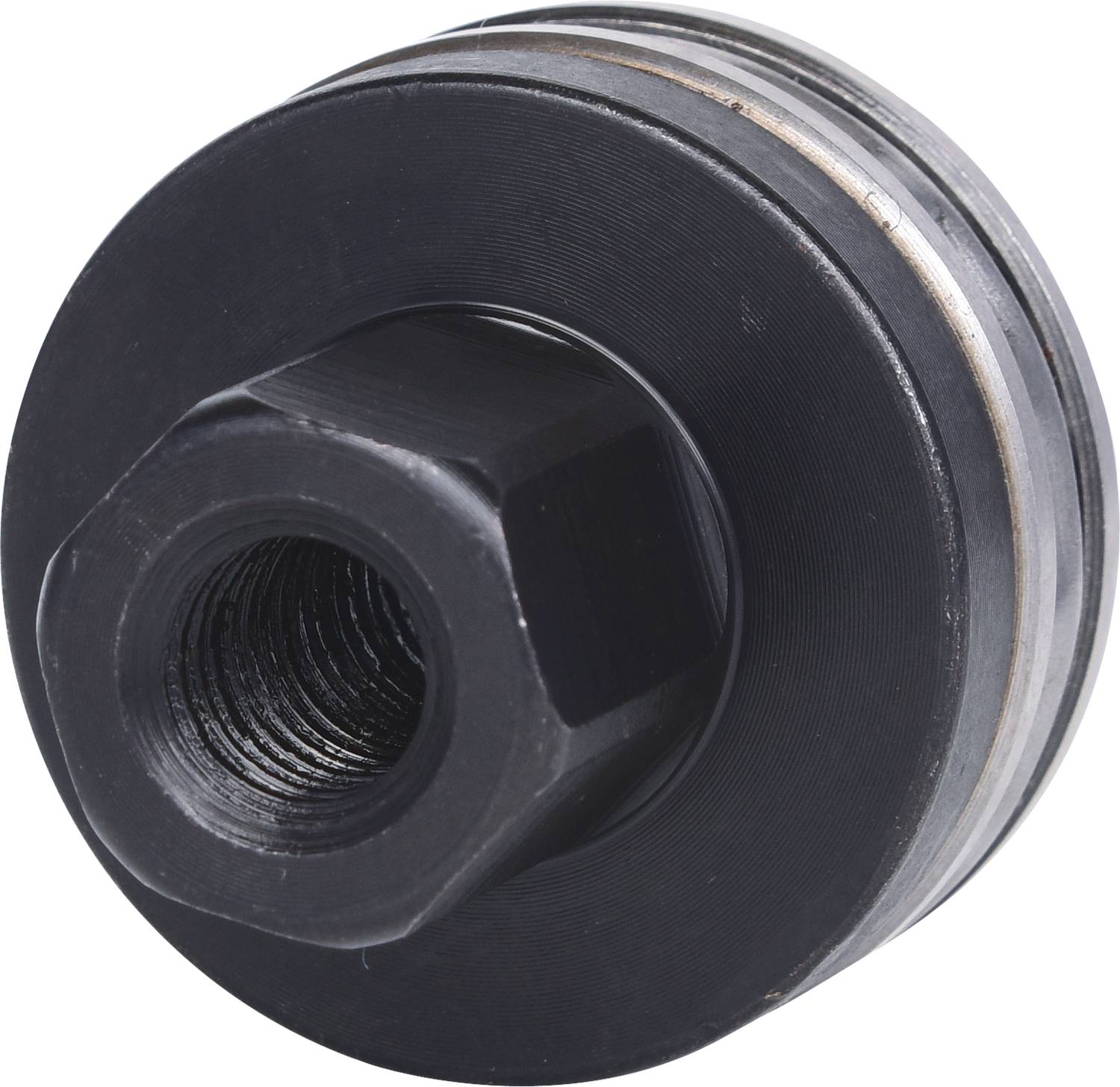 Eine schwarze Metallmutter mit Gewinde, zylindrisch geformt und von oben betrachtet.