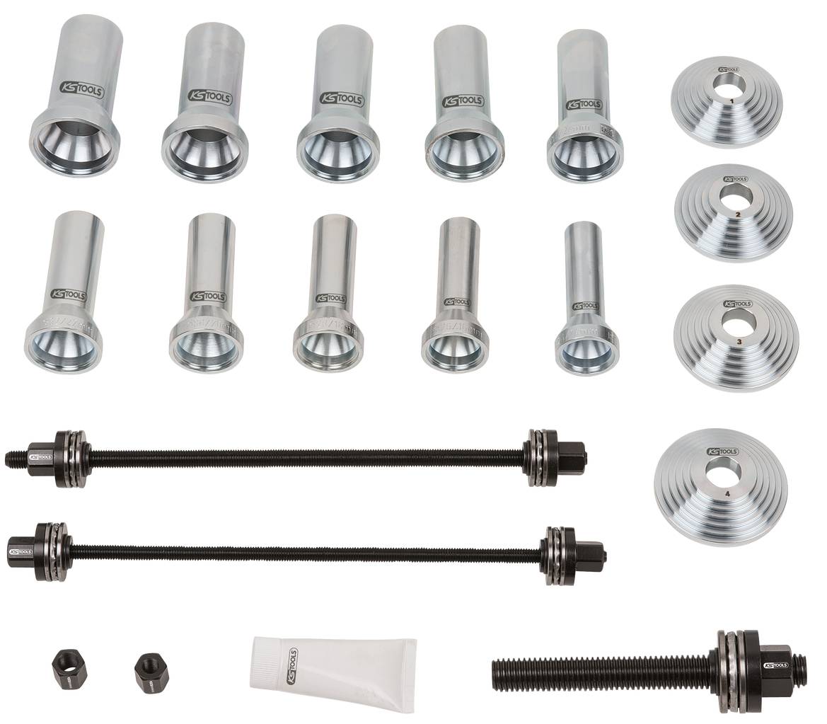 Werkzeugset zur Radlager-Montage. Enthält verschiedene Adapter, Büchsen, Spindeln und eine Tube Schmiermittel.