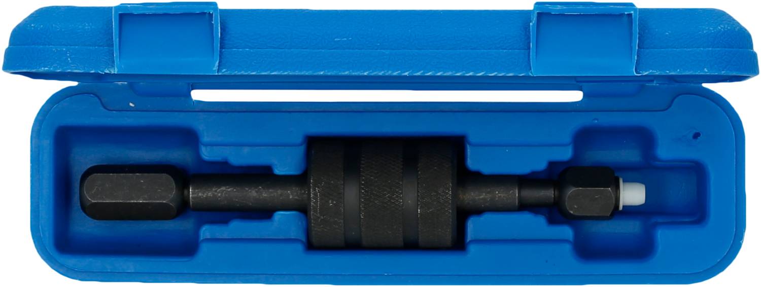 'In einem blauen Etui befindet sich ein schwarzes Werkzeug in Form eines kleinen Zylinders mit einem Sechskantaufsatz.'