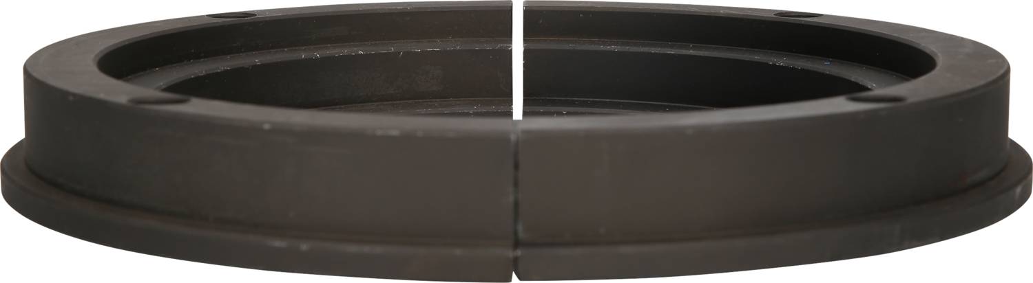 Ein zylindrisches, dunkelbraunes Bauteil aus Metall, horizontal geschnitten, mit einer Nut entlang des Umfangs.