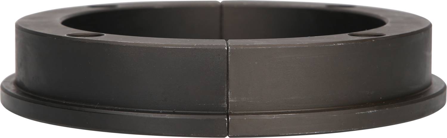 Ein geteilter Zylinder aus dunklem Metall mit mehreren Schraubenlöchern, möglicherweise Teil eines mechanischen Systems.