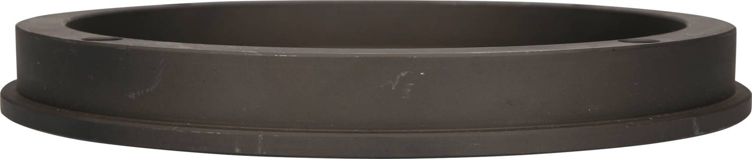 Ein braun-schwarzer, zylindrischer Ring aus Metall, der auf einer ebenen Fläche liegt. Funktion oder Material nicht spezifiziert.