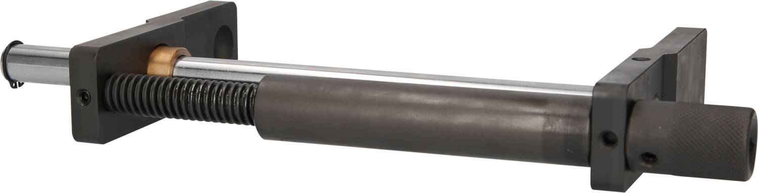 Ein Schraubspindel mit schwarzem Gehäuse und silbernem Metallteil, verwendet zum Klemmen oder Einstellen von Bauteilen in Maschinen.