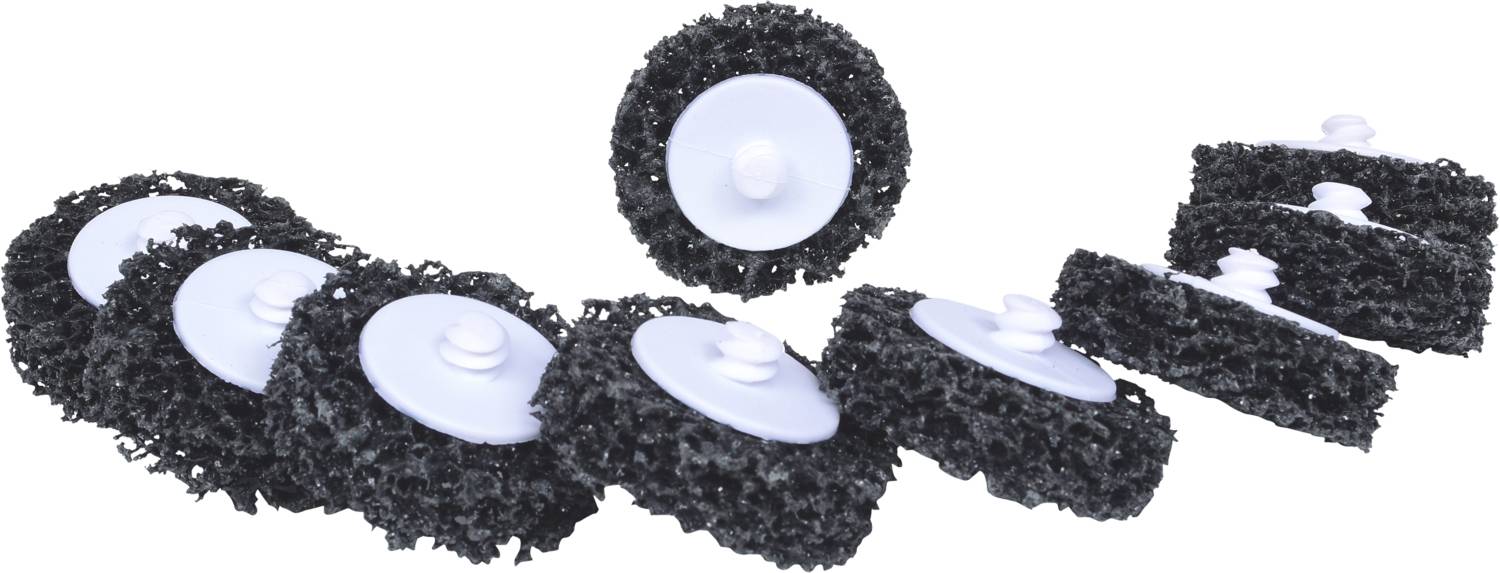 Acht schwarze, runde Scheiben mit zentralem weißen Knopf, gleichmäßig auf einer weißen Oberfläche verteilt.