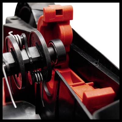 Nahaufnahme eines mechanischen Teils mit Federn und Zahnrädern in Schwarz und Rot; zeigt technische Details und Strukturen.