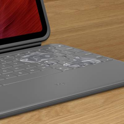 Ein Laptop mit transparenten Einlegekarten, die auf der Tastatur liegen. Die Einlegekarten zeigen verschiedene Shortcuts.