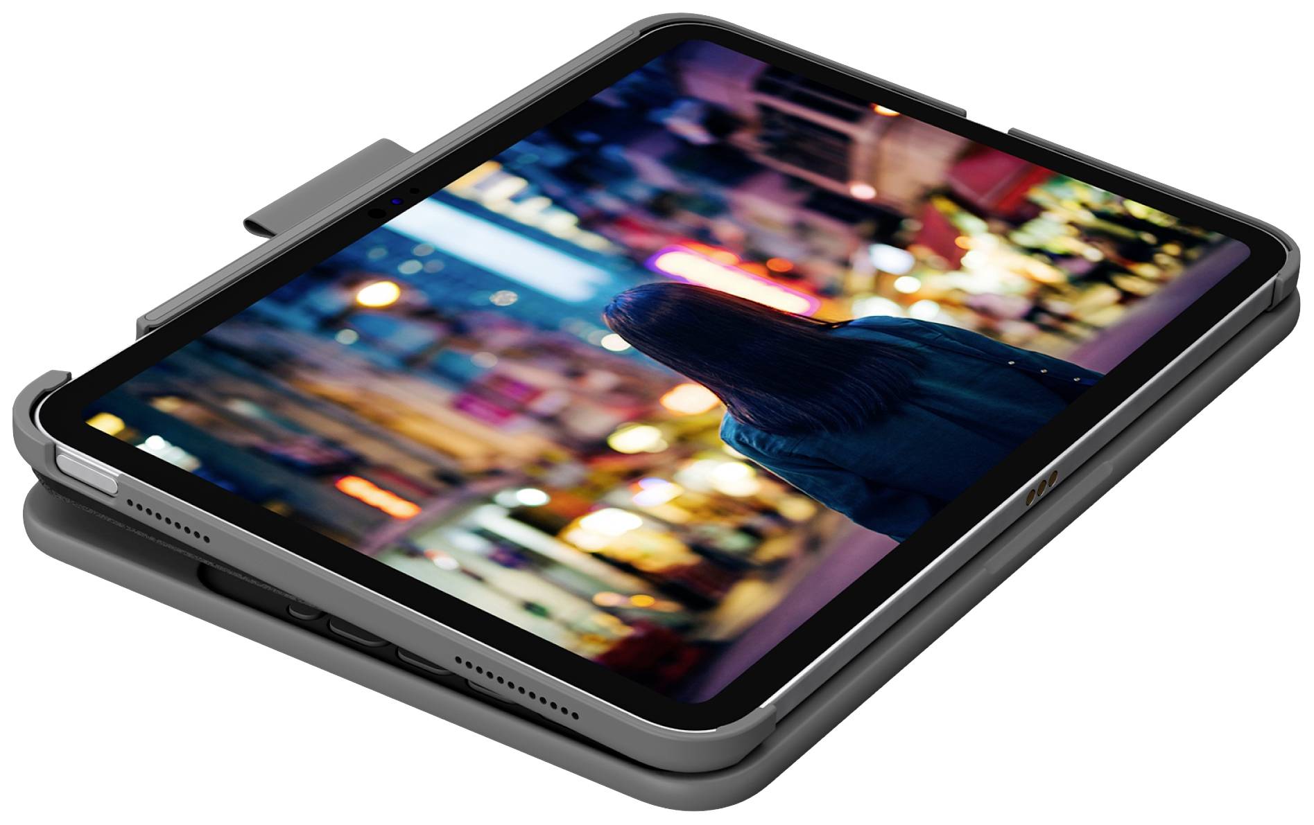 Ein Tablet liegt auf einem Tisch. Der Bildschirm zeigt ein unscharfes Stadtbild mit einer Person, die Lichter betrachtet.