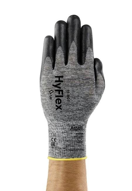 Eine Hand in einem grauen Arbeitshandschuh mit schwarzer Beschichtung, markiert mit 'HyFlex #11-801', zeigt mit der Handfläche nach vorne.