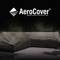 Schwarze Abdeckplane schützt eine Eckcouch im Freien, mit dem Logo 'AeroCover' und dem Slogan 'Breathable Protection' oben.