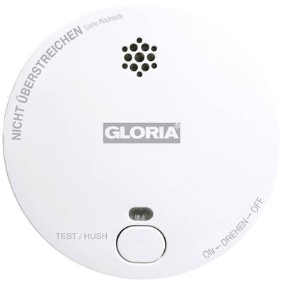 Runder Rauchmelder mit dem Aufdruck 'GLORIA', einem Testknopf, einem kleinen Gitter für den Alarmton und Beschriftungen zur Nutzung.
