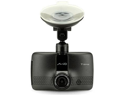Eine schwarze Dashcam mit Objektiv in der Mitte und Saugnapfhalterung an der Oberseite. Markenlogo 'Mio' sichtbar.