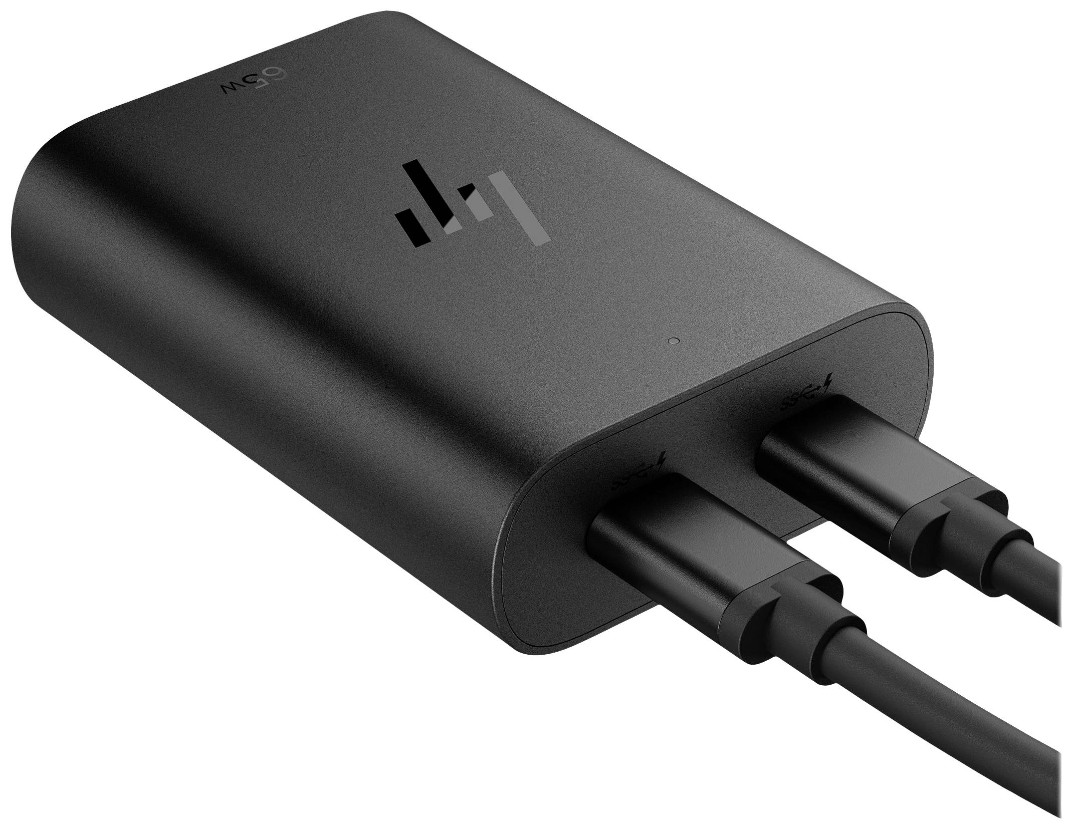 Schwarzes Elektrozubehör mit zwei angeschlossenen Kabeln, dargestellt auf einer schrägen Oberfläche.