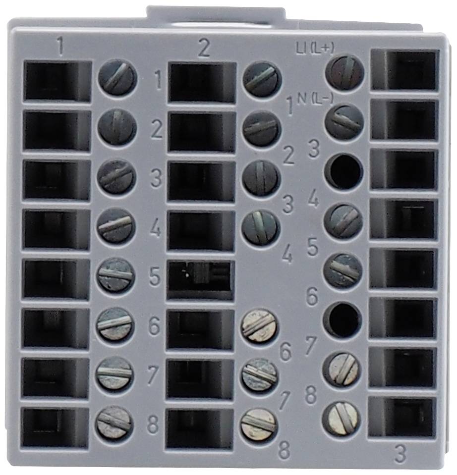 Ein grauer elektrischer Anschlussblock mit nummerierten Schraubanschlüssen von 1 bis 8 für Drähte, an der Oberkante sind 'L/+(-)' und 'N(-)' markiert.