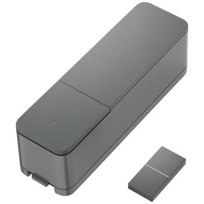 Grauer rechteckiger Elektronikkasten mit abnehmbarem Deckel, daneben kleineres rechteckiges Bauteil.