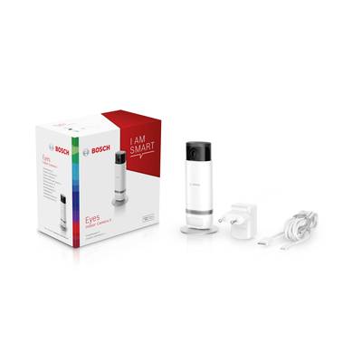 Bosch Eyes Innenkamera mit weißem Gehäuse, Stromadapter und Ladekabel nebeneinander. Verpackung mit 'I Am Smart'-Aufschrift.