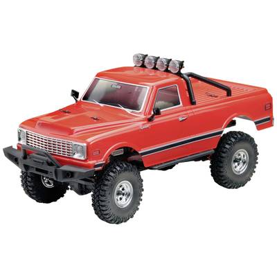 Rotes Spielzeug-Geländewagen-Modell mit großen Reifen und vier Scheinwerfern auf dem Dach, abgebildet vor weißem Hintergrund.