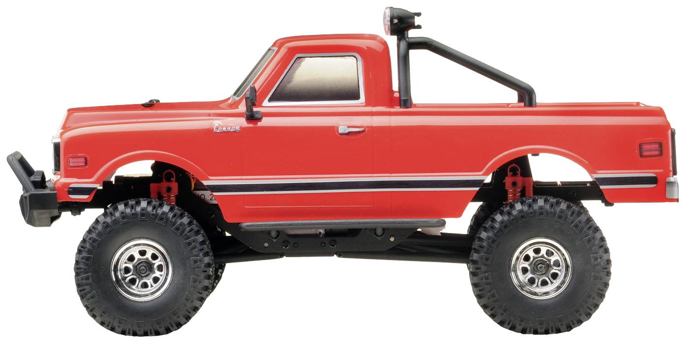 Rotes Spielzeug-Geländefahrzeug mit großen Reifen und Stoßstangen, seitliche Ansicht.