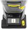 Industrieller Staubsauger von oben mit Akkufach und gelbem Griff sichtbar.