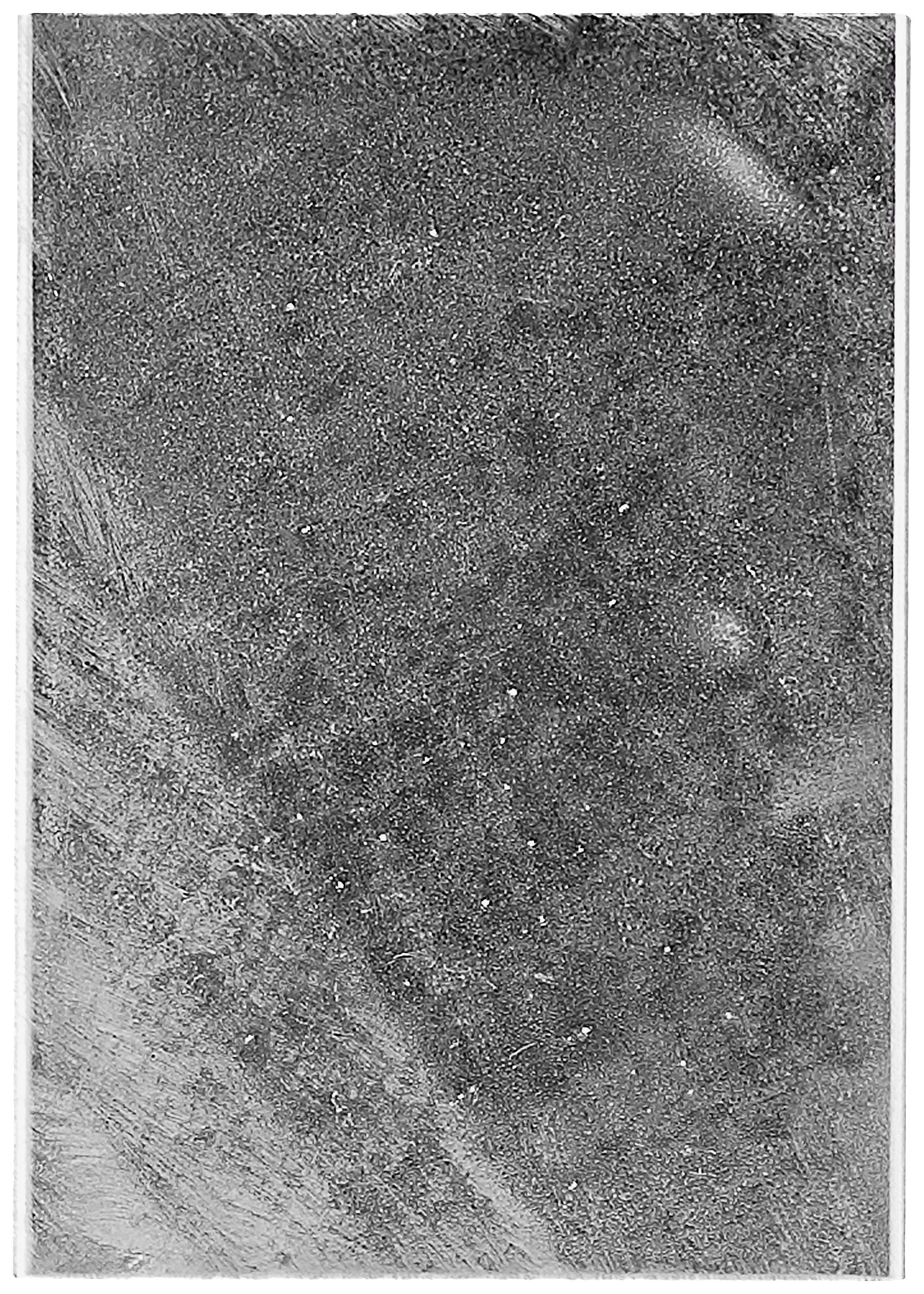 Texturierte Oberfläche mit verschiedenen Schattierungen von Grau, die an Beton erinnert. Keine erkennbaren Muster oder Objekte.