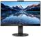 Ein Computermonitor zeigt eine atemberaubende Landschaft mit Bergen im Hintergrund und einem ruhigen See im Vordergrund, der die Berge spiegelt.