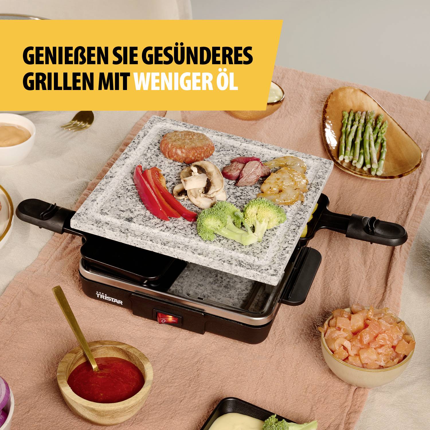 Grill mit verschiedenen Gemüsesorten und Fleischstücken auf Steinplatte. Text sagt: 'Genießen Sie gesünderes Grillen mit weniger Öl'.