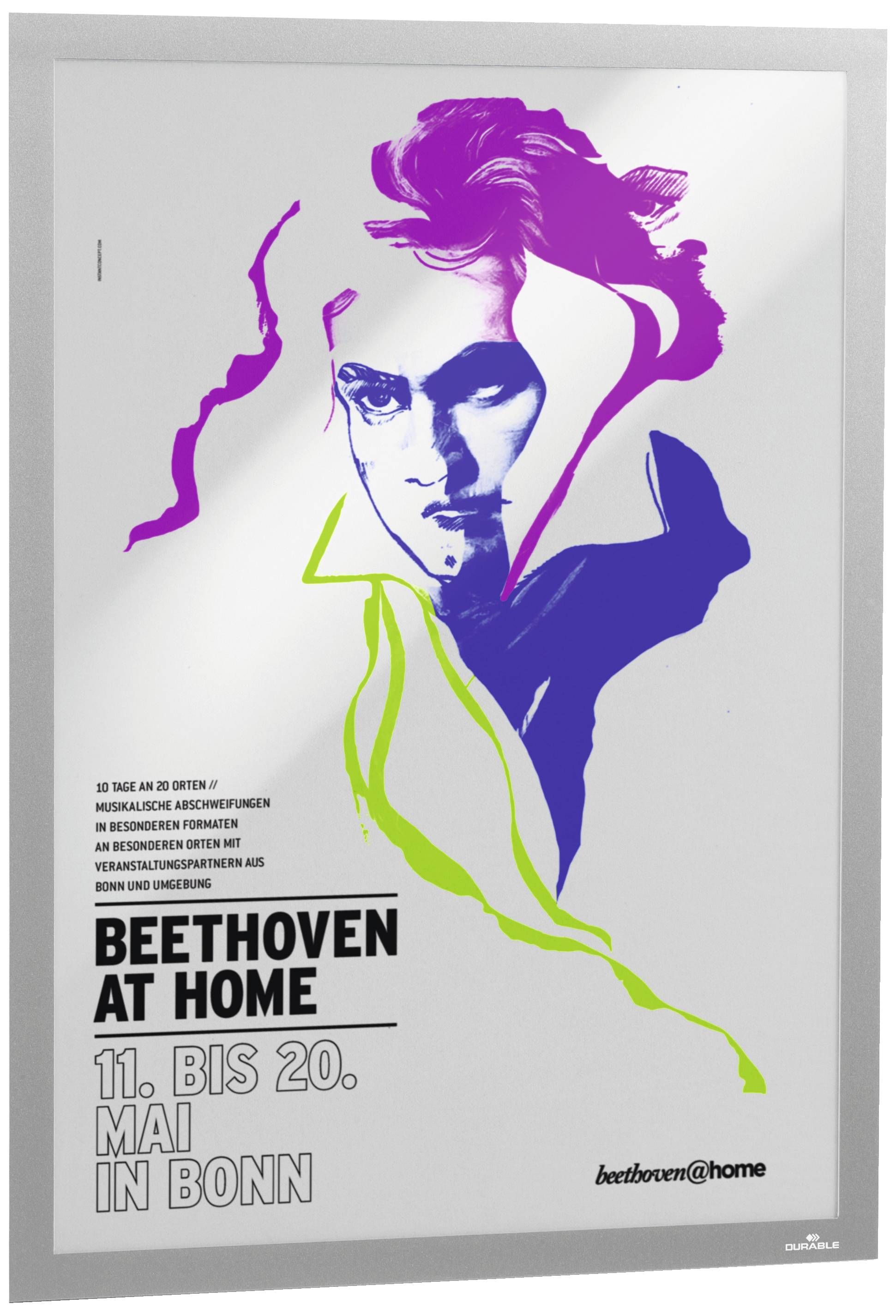 Poster zeigt ein stilisiertes Porträt von Beethoven in bunten Farben. Text: 'BEETHOVEN AT HOME 11. BIS 20. MAI IN BONN'.